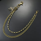 Multi-layered gold waist chain with skull pendant