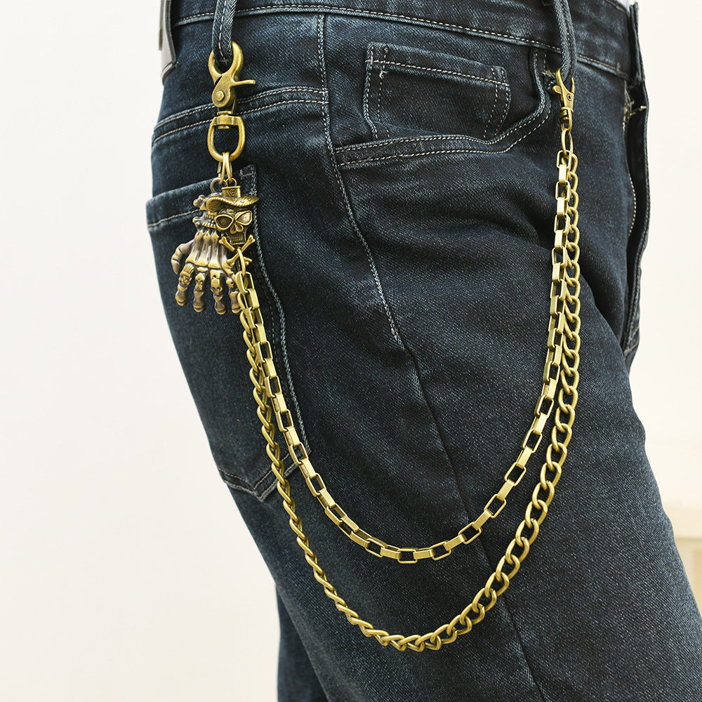 Multi-layered gold waist chain with skull pendant