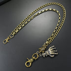 Multi-layered gold waist chain with skull pendant