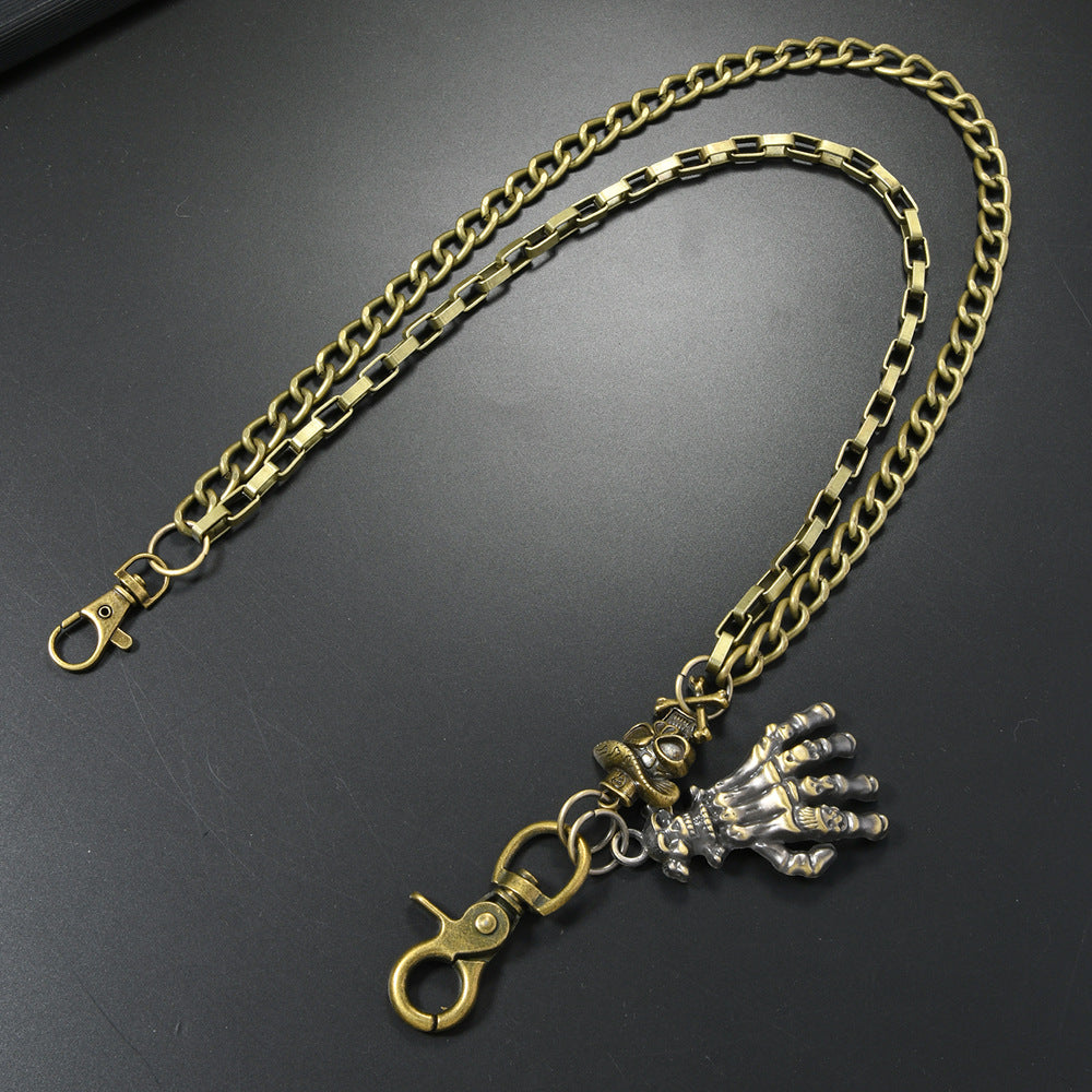 Multi-layered gold waist chain with skull pendant