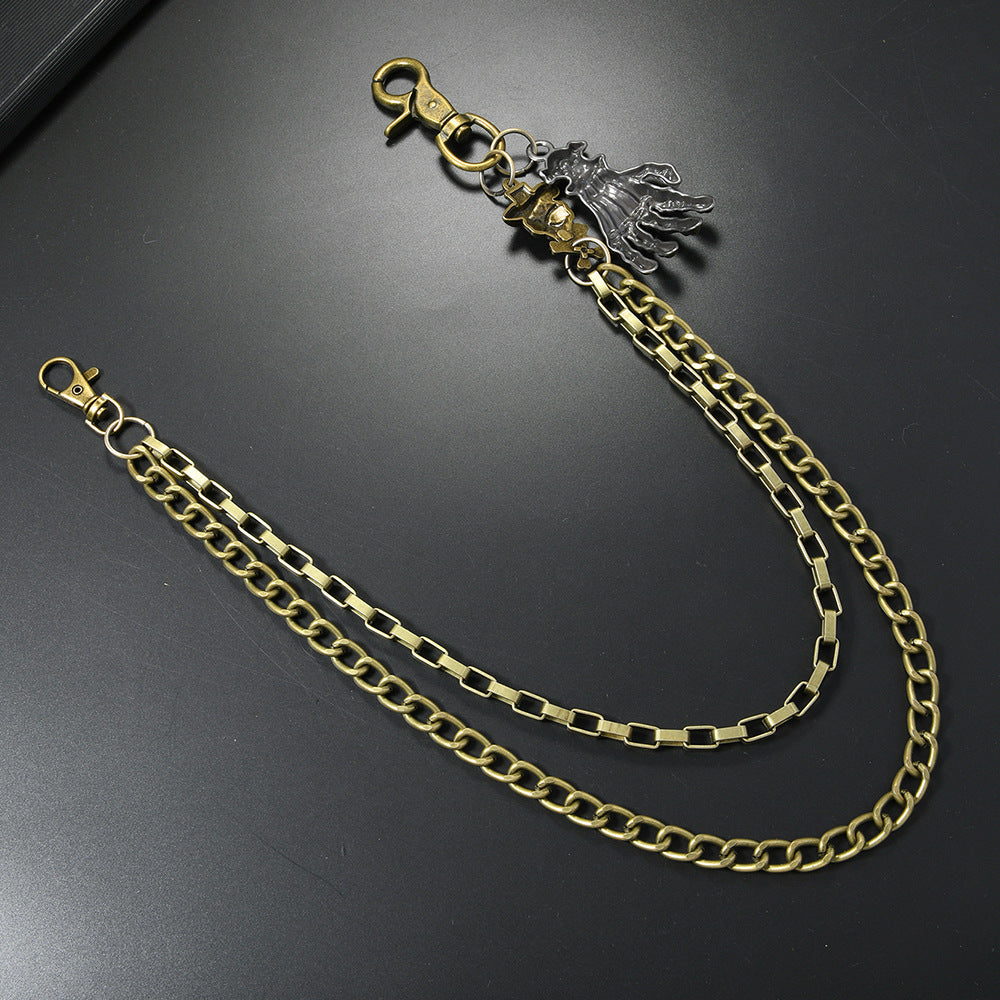Multi-layered gold waist chain with skull pendant